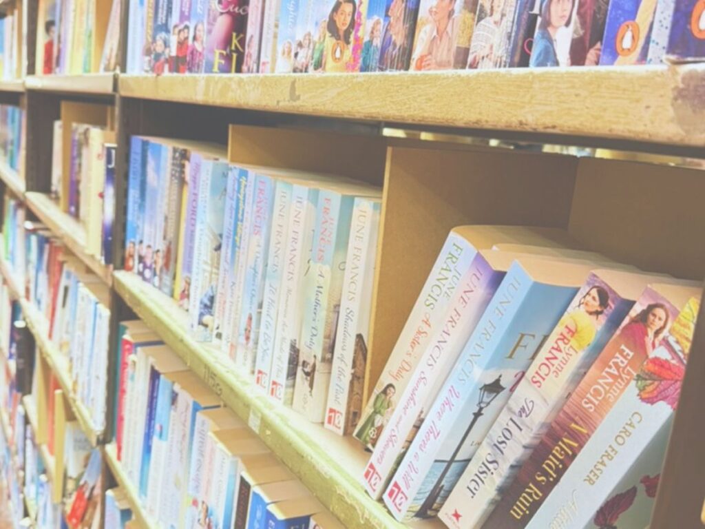 Shelves in a bookshop with lots of books on them