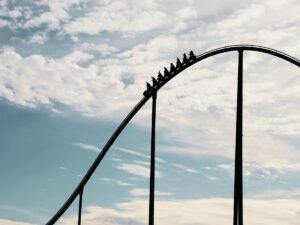 A rollercoaster to signify the up and downs of post-cancer treatment